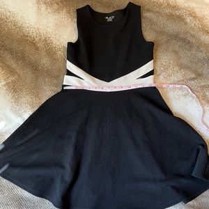 Children’s place black with white dress with mesh detail on waist. Size 14 Girls